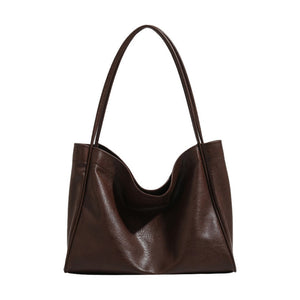 Brown leather handbag on a white background