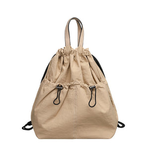 Lightweight drawstring bucket backpack in beige with top handles