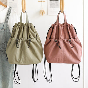 Casual bucket backpack shown in multiple everyday colors