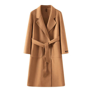 Tan coat with a belt on a white background