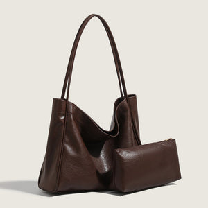 Brown retro minimalist commuter tote bag with matching pouch on a light beige background