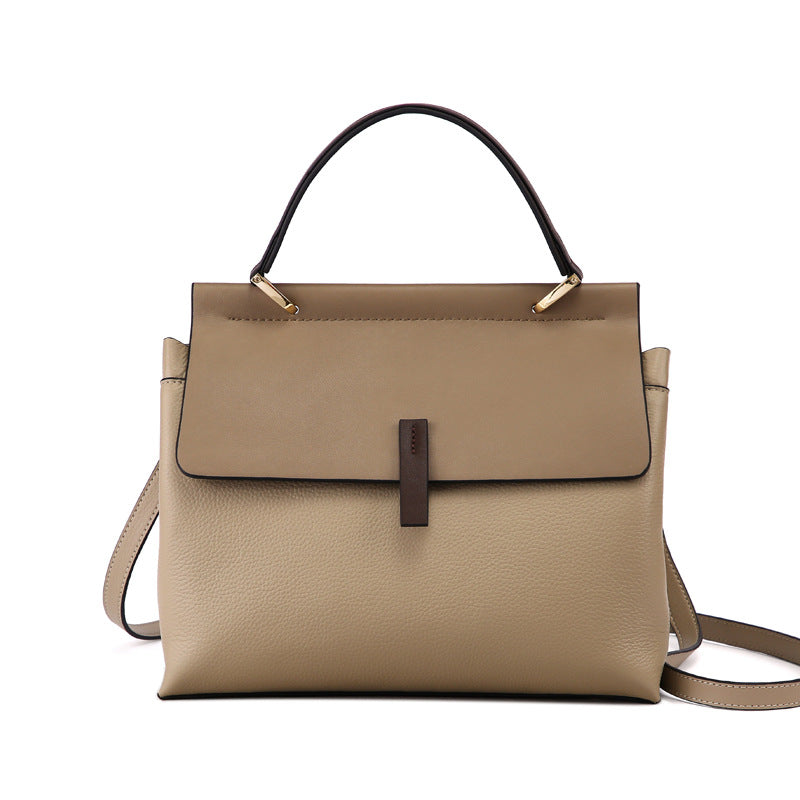 genuine leather shoulder tote bag with a strap on a white background