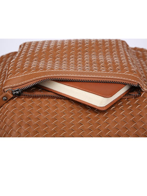 Brown woven leather bag with a zipper on a white background