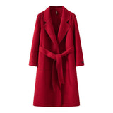 Red women's loose fit mid-length coat with a belt on a white background