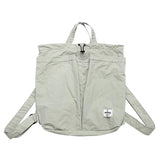 Light gray backpack with a visible brand label on a white background