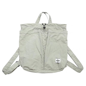 Light gray backpack with a visible brand label on a white background