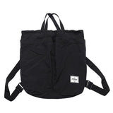 Black backpack with a visible brand label on a white background