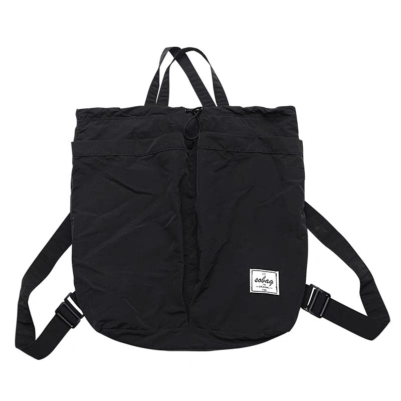 Black backpack with a visible brand label on a white background