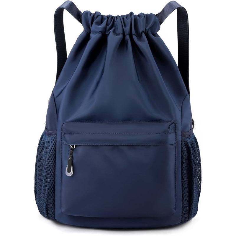 Navy blue drawstring backpack with a front pocket on a white background